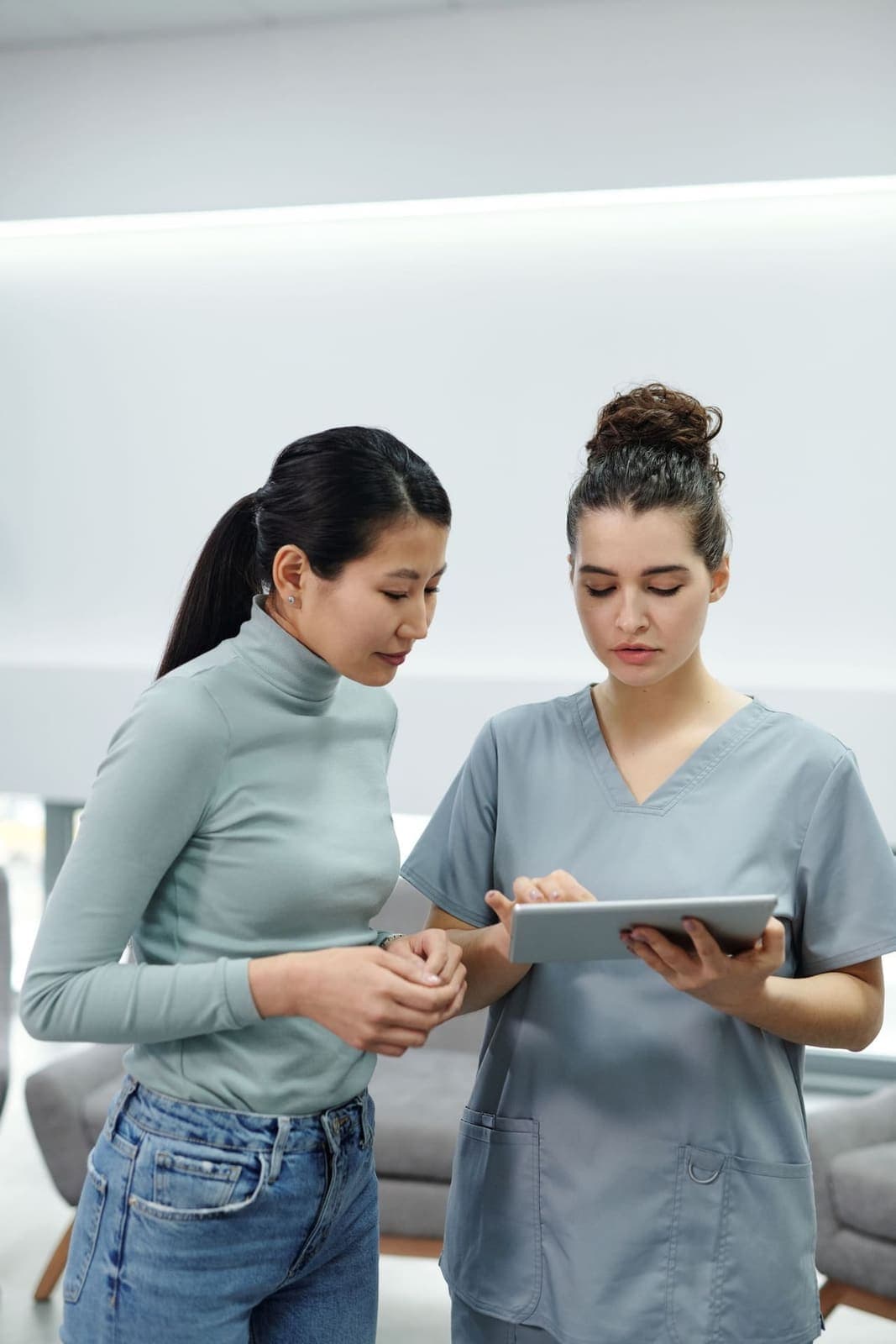 Clinician consulting with a patient