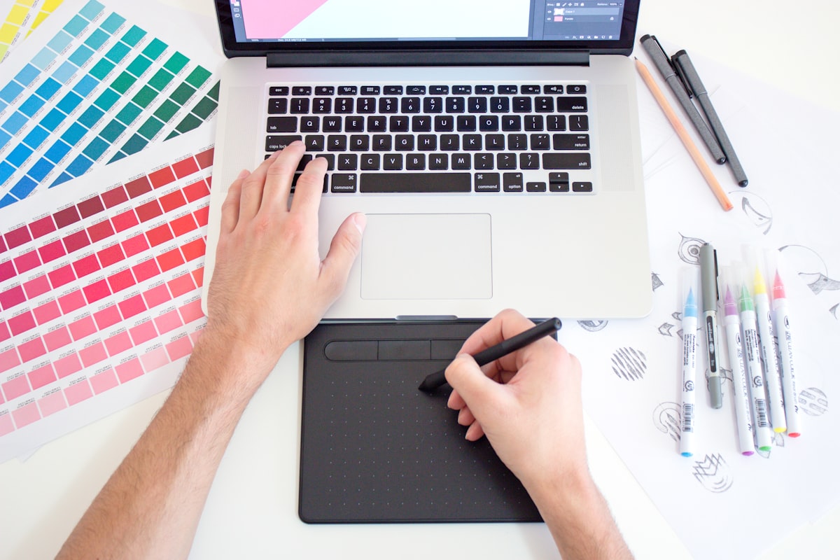 Graphic designer working with colour swatches and sketches